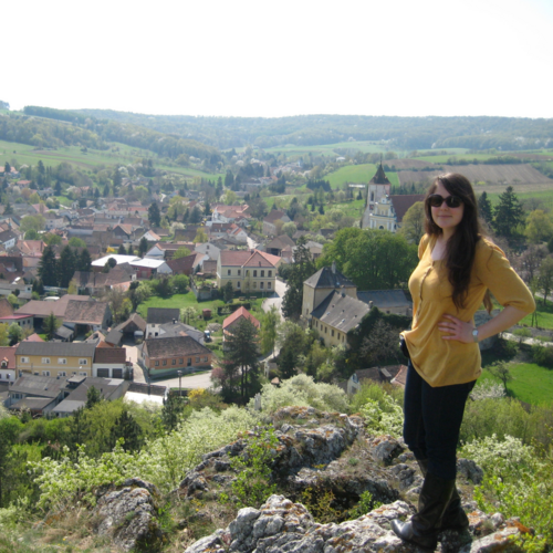 Photo of Maria standing on hill overlooking an Austrian village