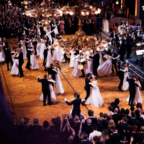 Photo of performers waltzing at the ball